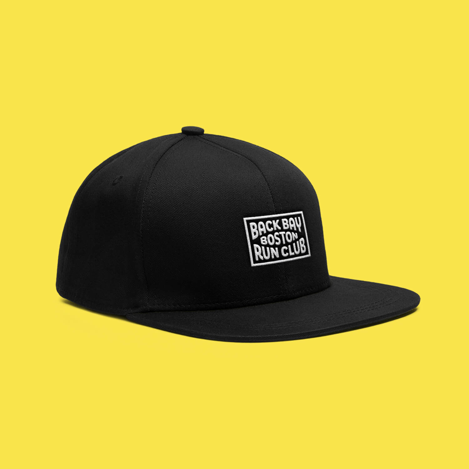 Black Back Bay Run Club snapback hat featuring a white patch