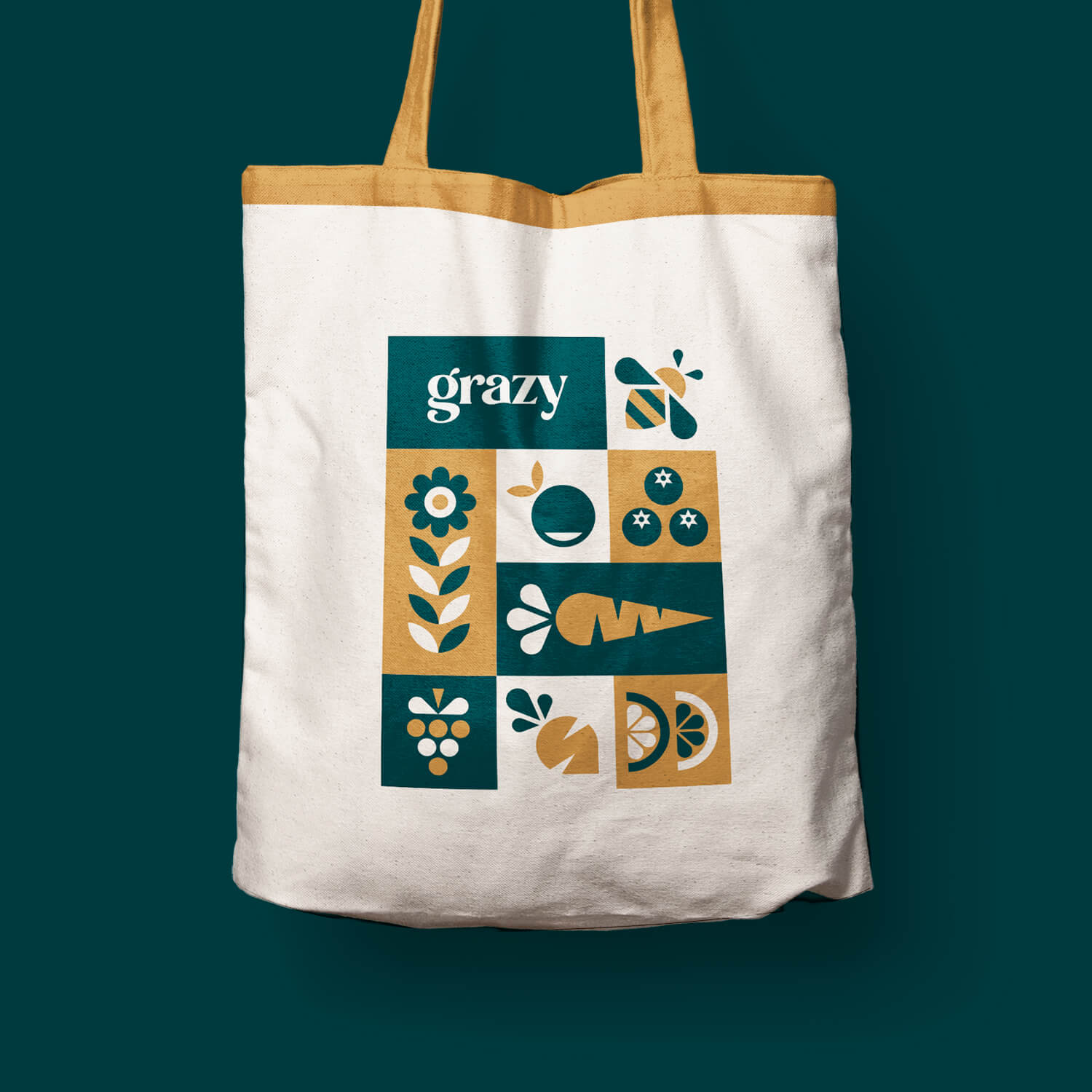 Tote bag featuring a tiled illustration and Grazy wordmark on the side