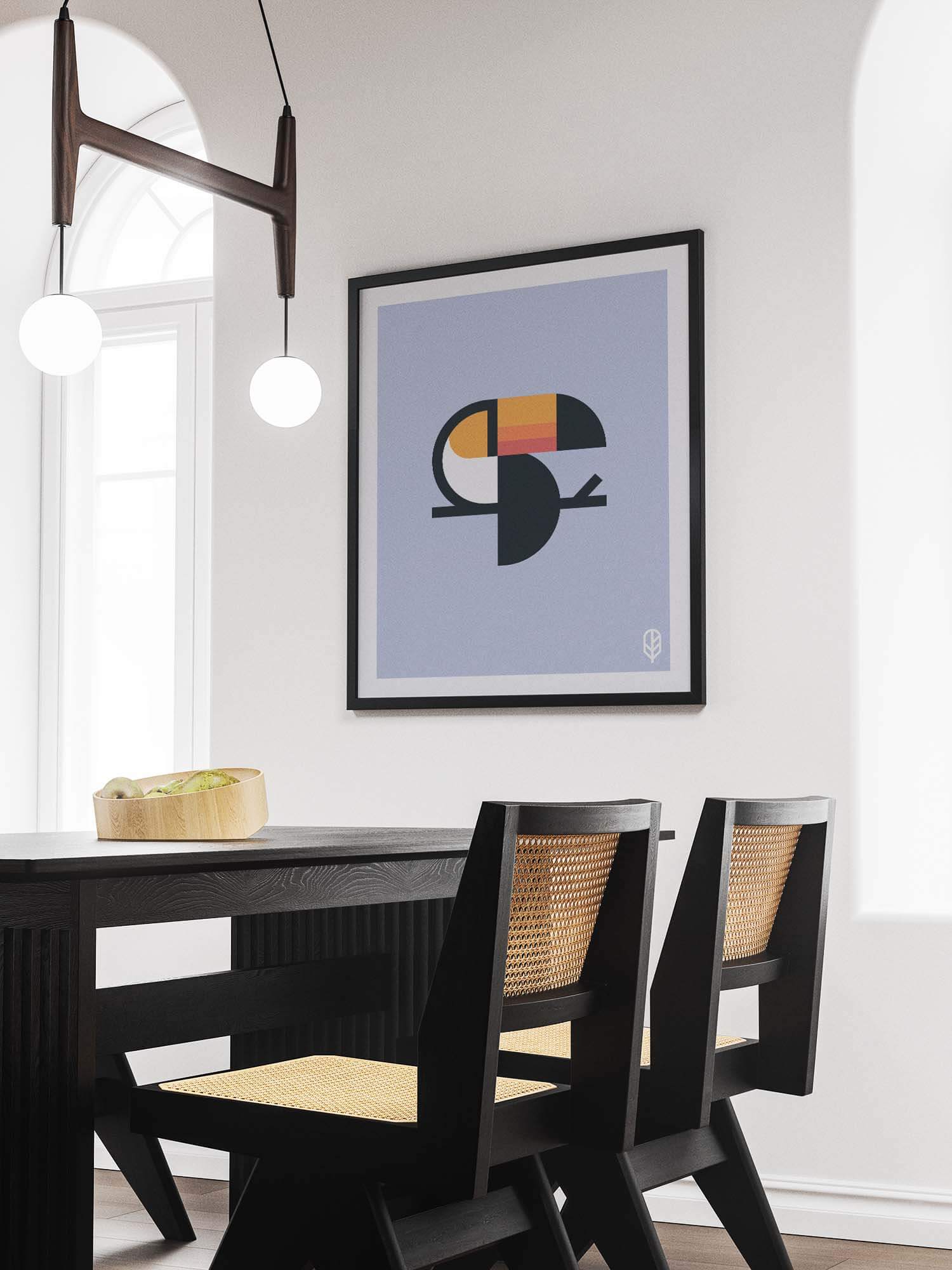 Framed Flock Together print displaying the illustration of a toucan on the wall of a modern apartment