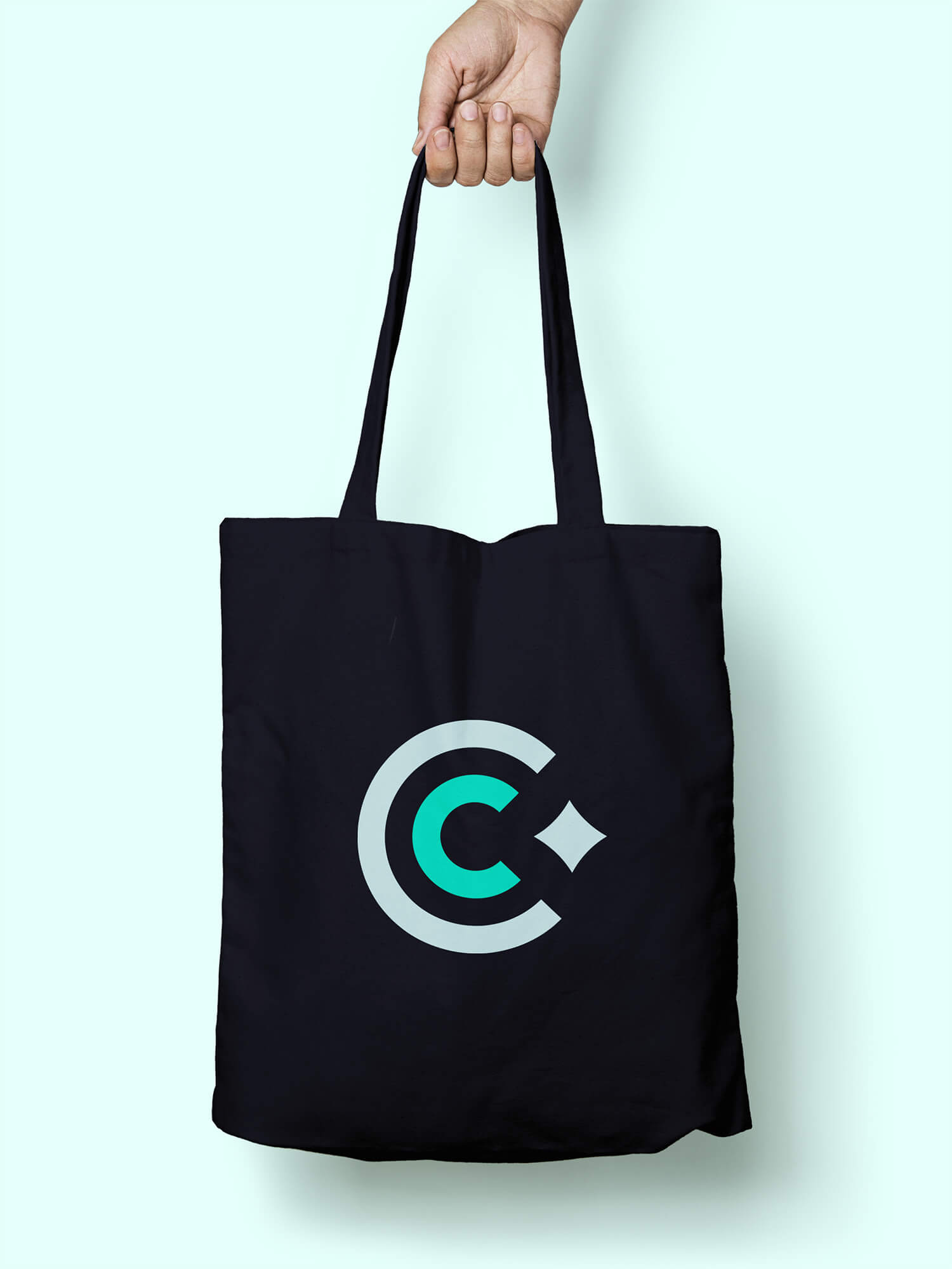 Charcoal Condiments Club CC monogram on a charcoal tote bag