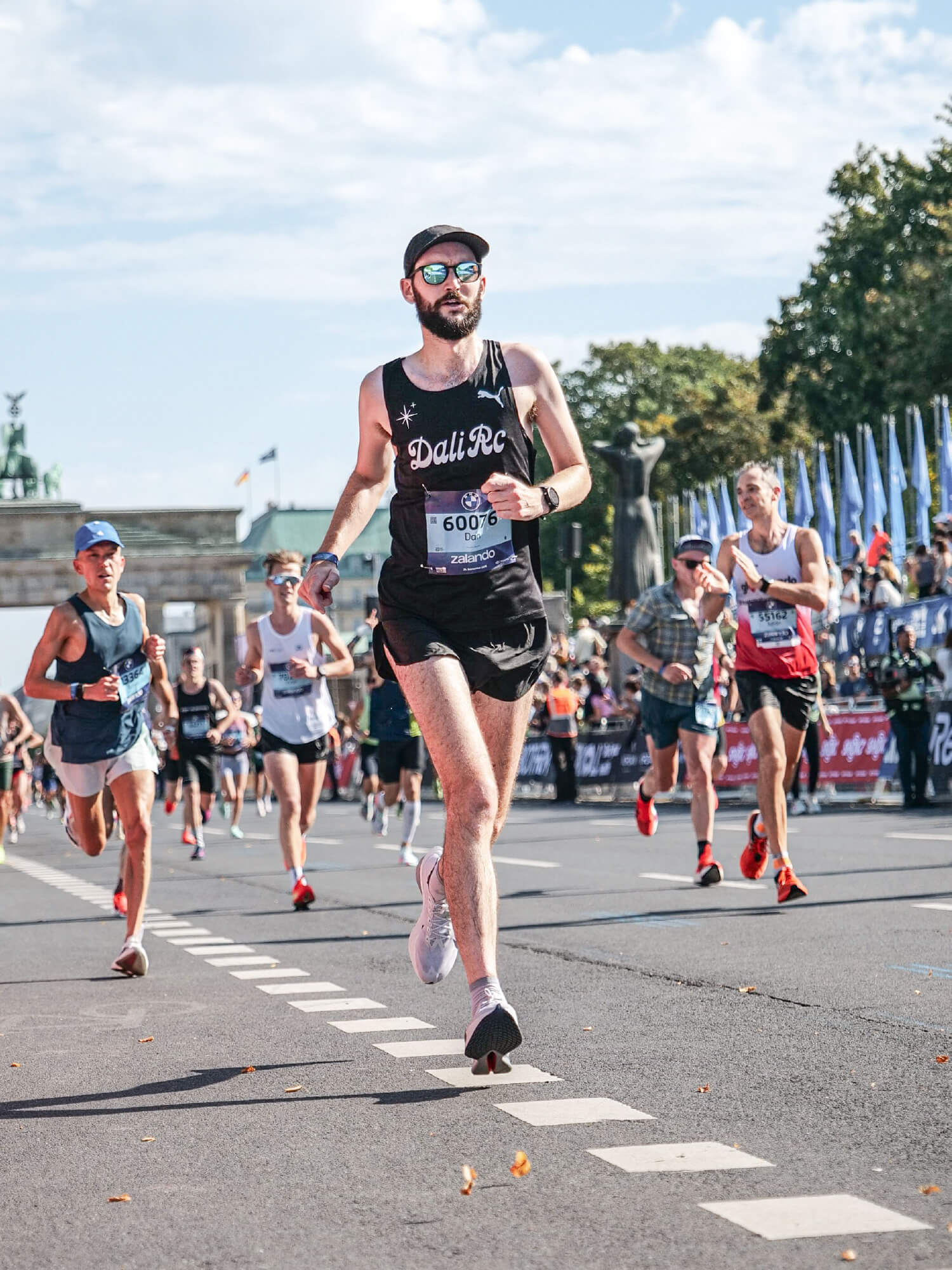 Dan running the Berlin Marathon in a DALI RC singlet near the finish