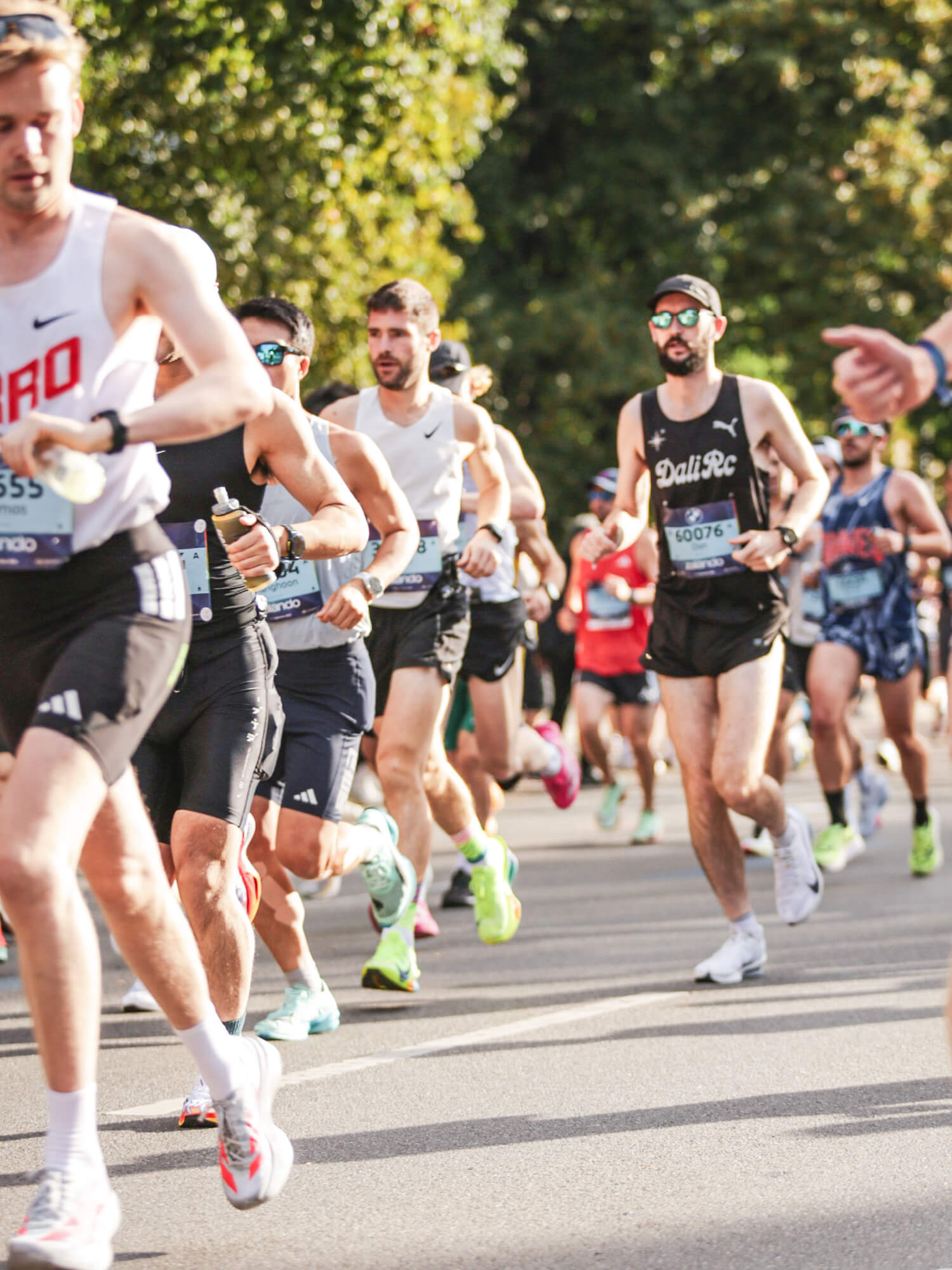 Dan running among a pack of Berlin Marathon runners in a DALI RC singlet
