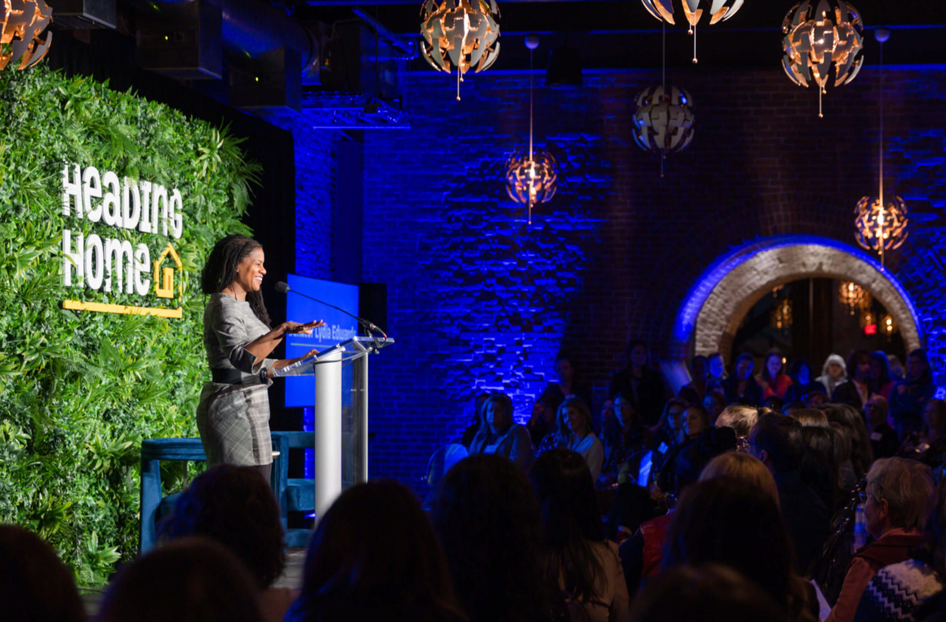 A speaker addressing guests at a Heading Home fundraising event